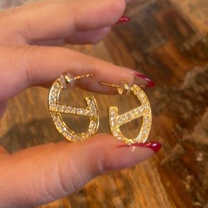 Double sided earrings. Teal enamel on one side, crystals on the other.Goldplated